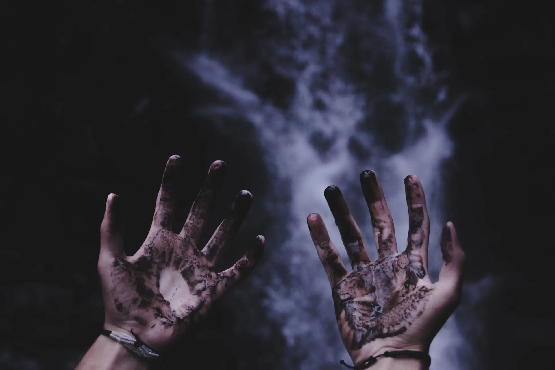 Close-up of an artisan's hands at work in a luxury automotive atelier