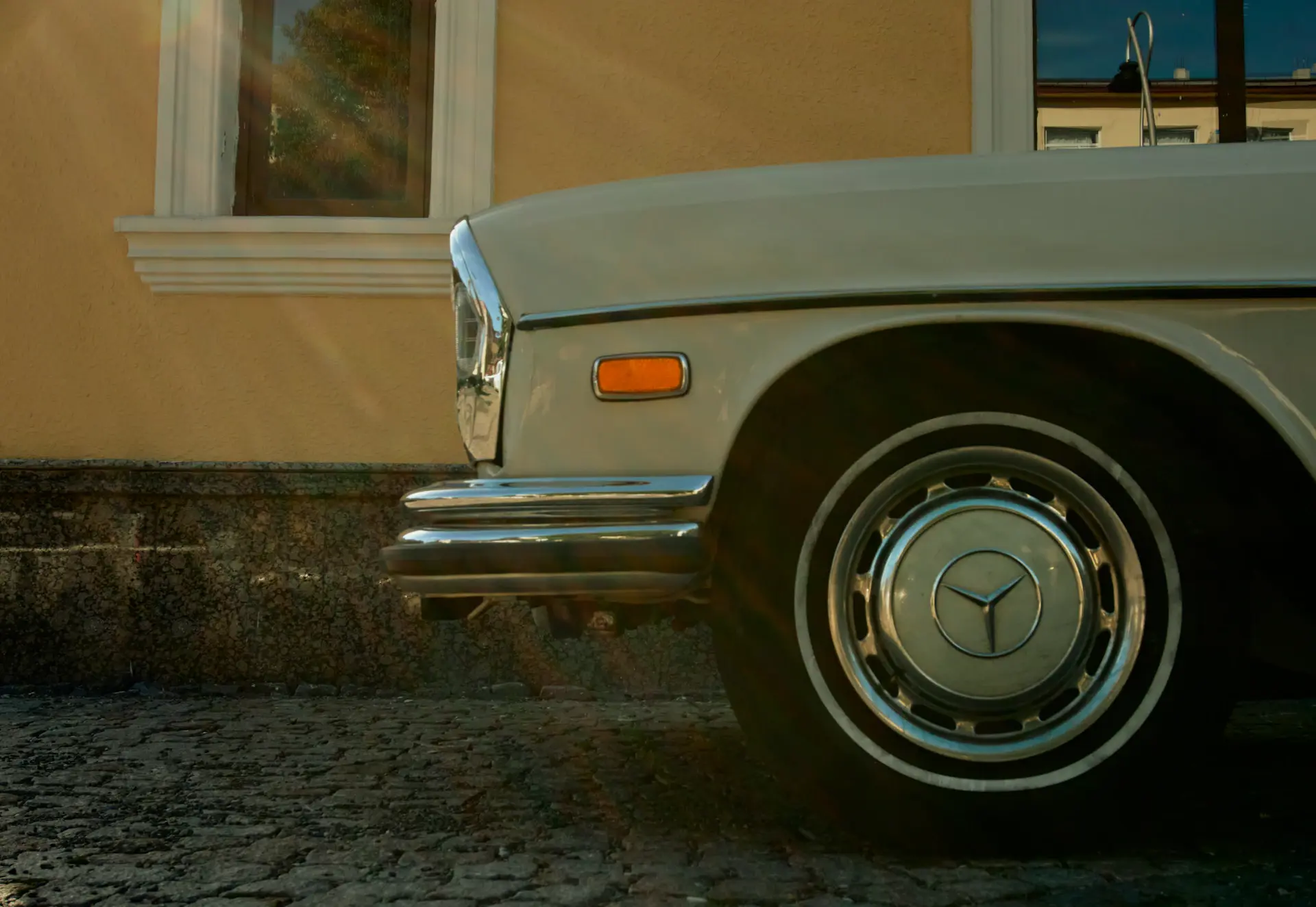 Sweeping exterior profile of the grand tourer under cinematic light