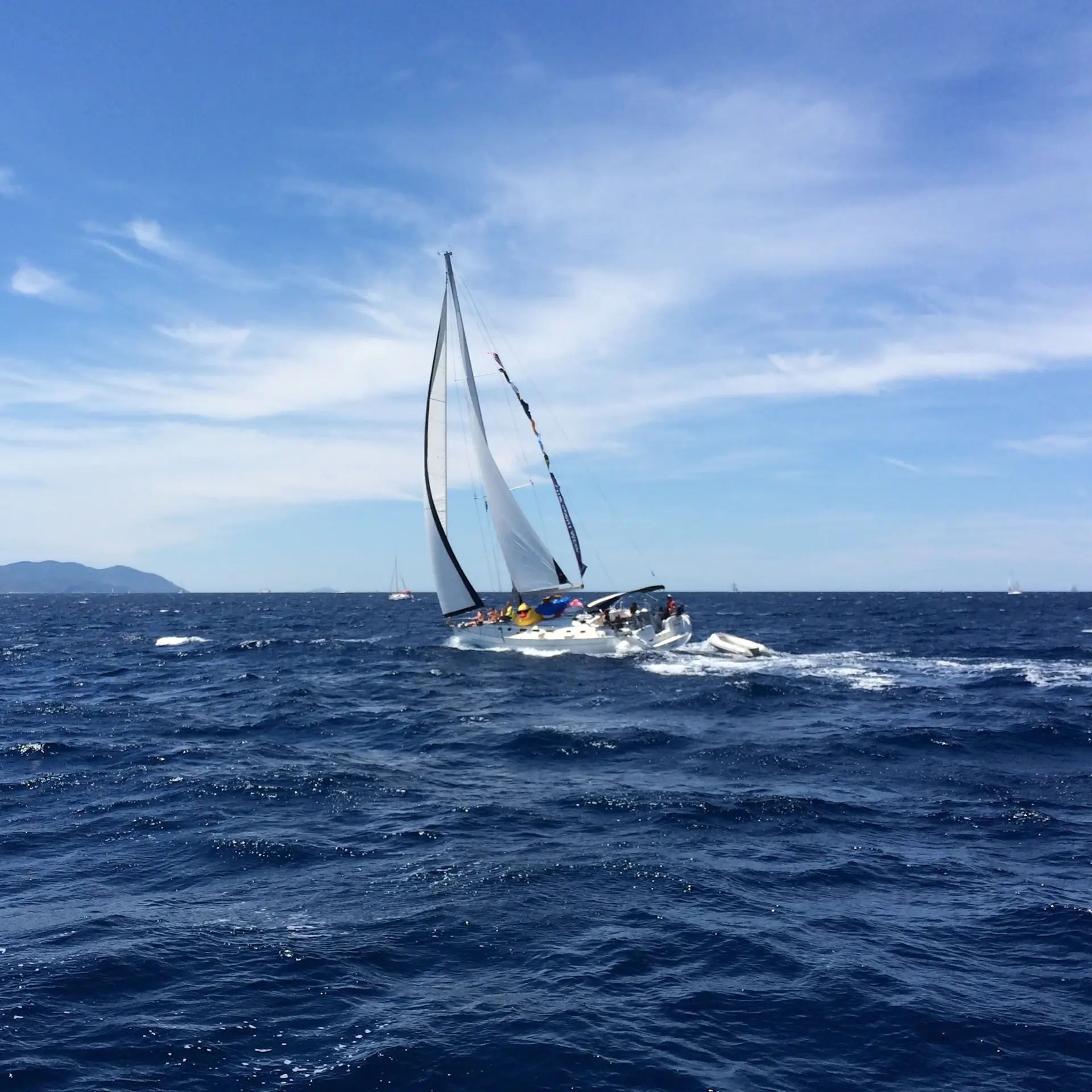 Sailing yacht anchored in a quiet bay