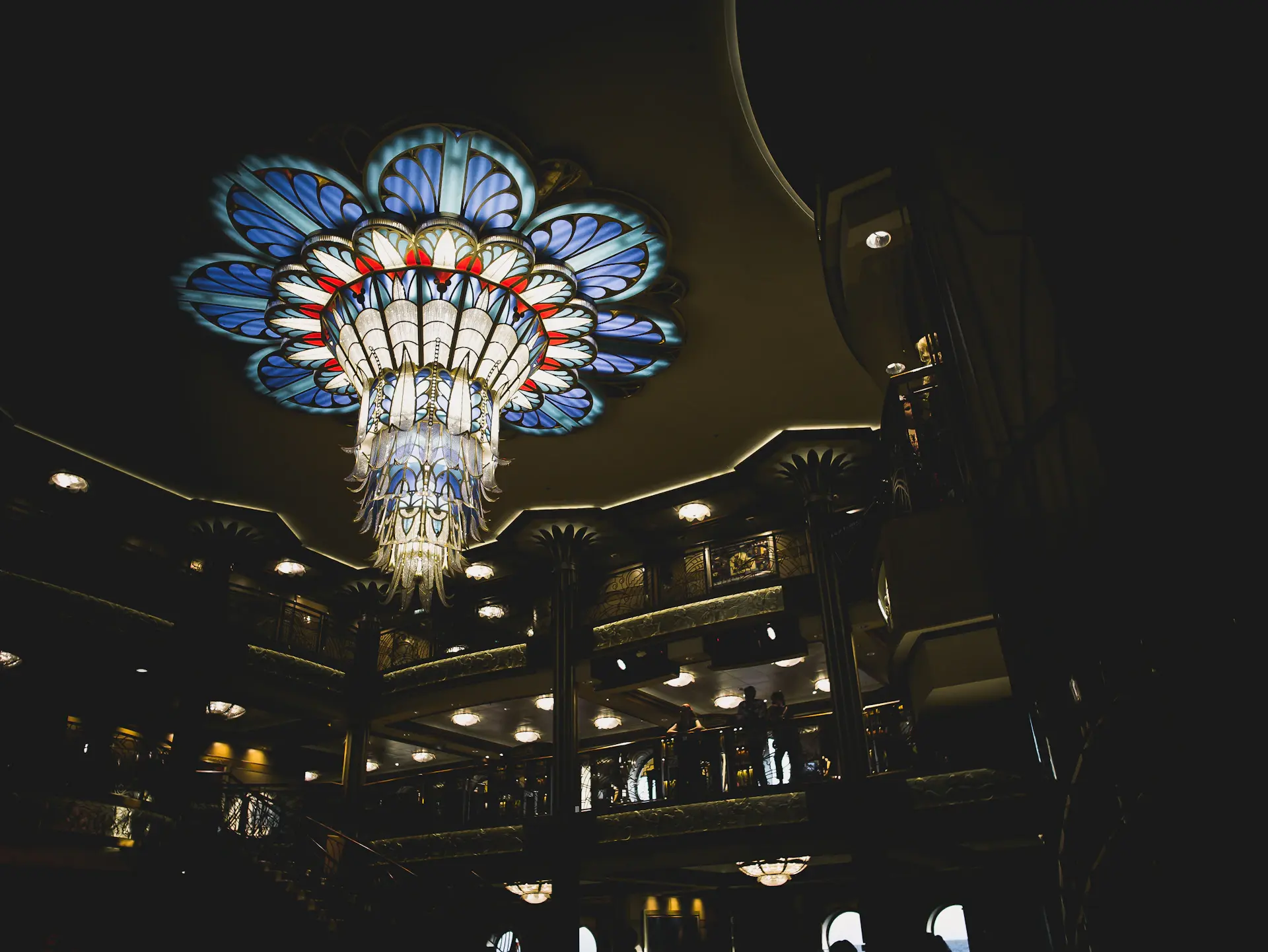 Gilded ballroom interior of Aurielle with crystal chandeliers