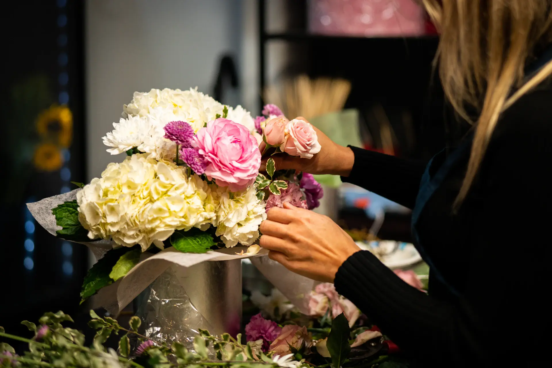 Artisan finishing a bridal bouquet
