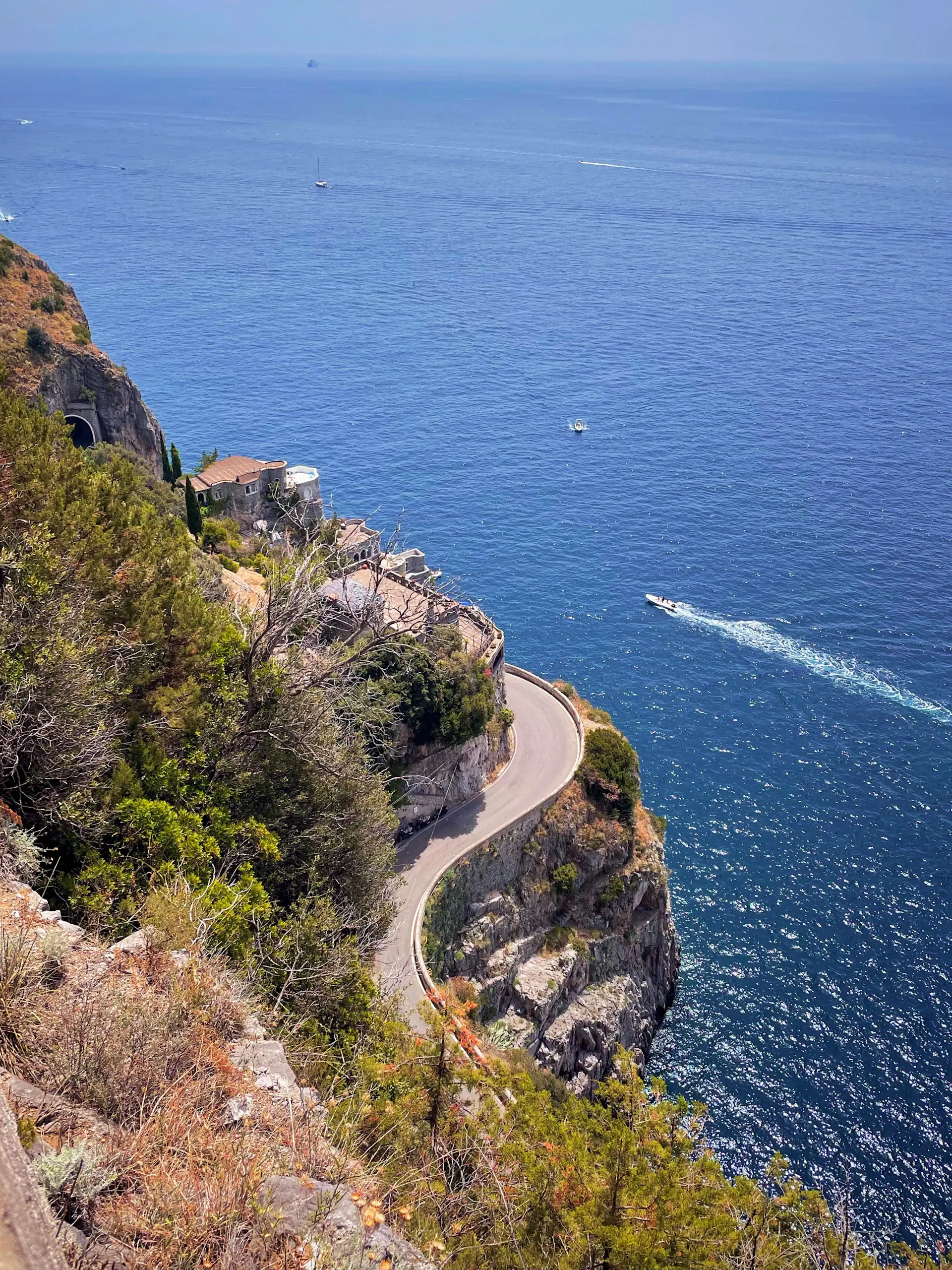 A luxury motorcar on the cliffside roads of the Amalfi Coast