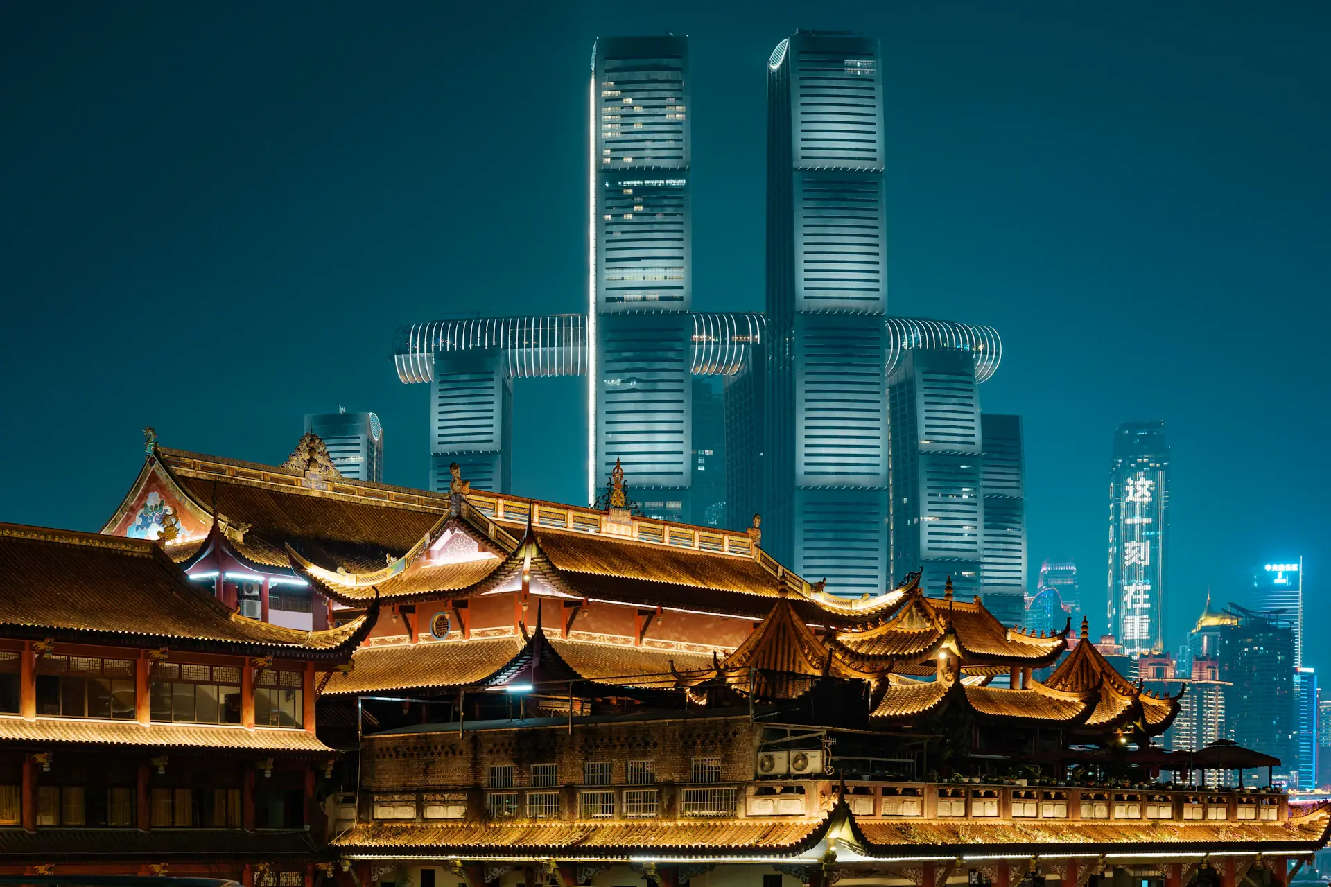 Traditional Chinese architecture beside a futuristic city skyline