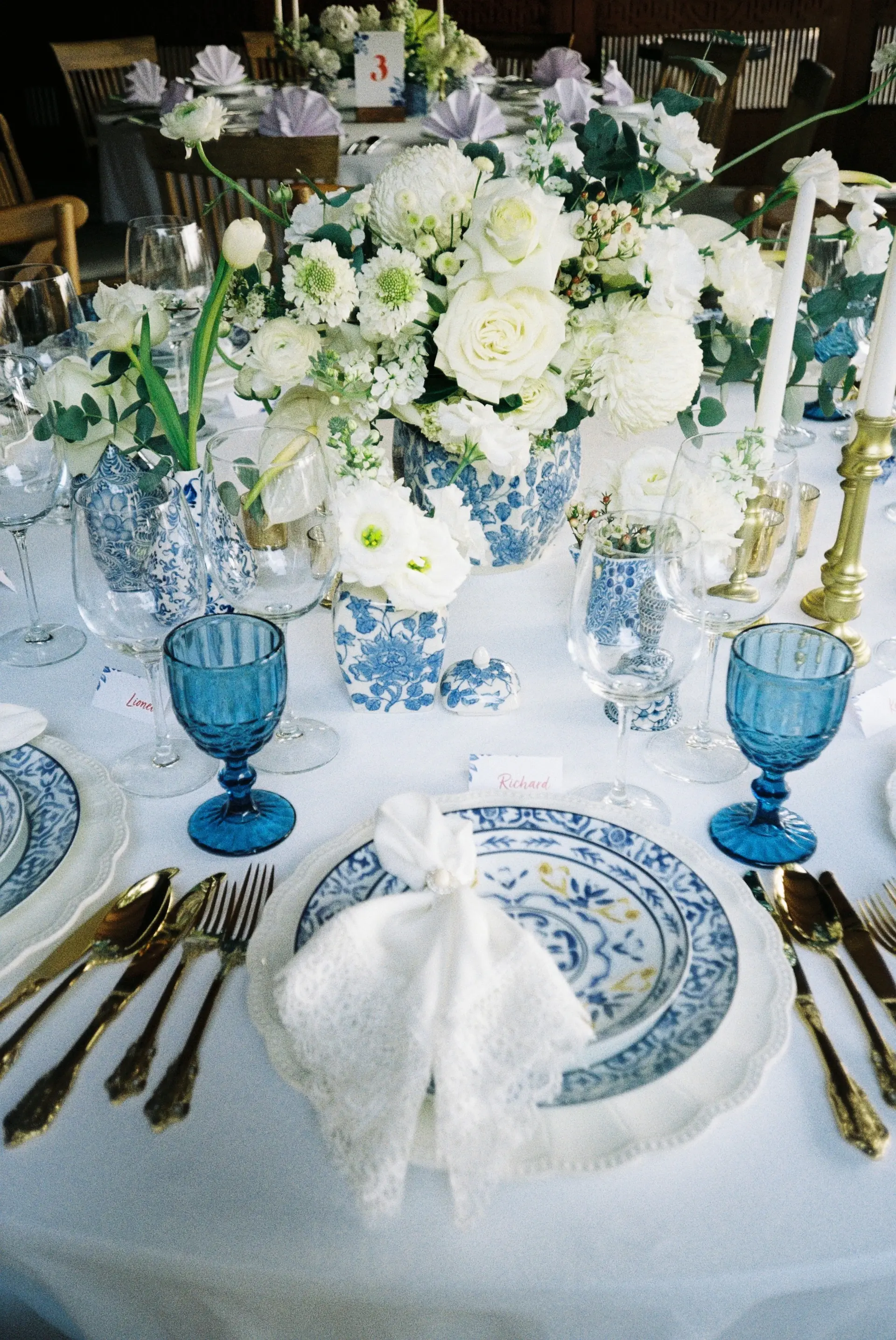 An elegant tablescape with crystal glassware and ivory florals