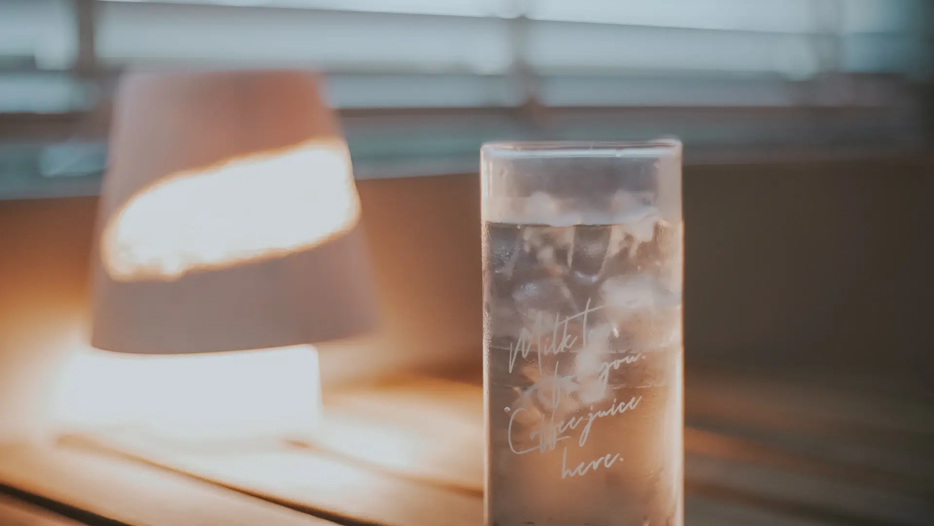 Slow-brew coffee dripping into a glass server, soft window light