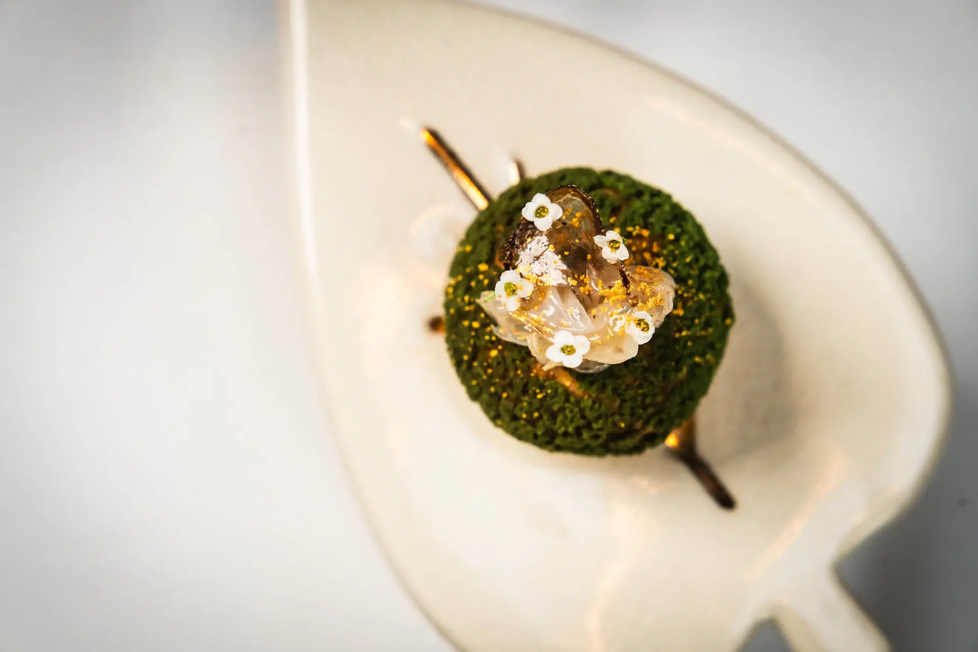 Elegant dessert with gold leaf detail