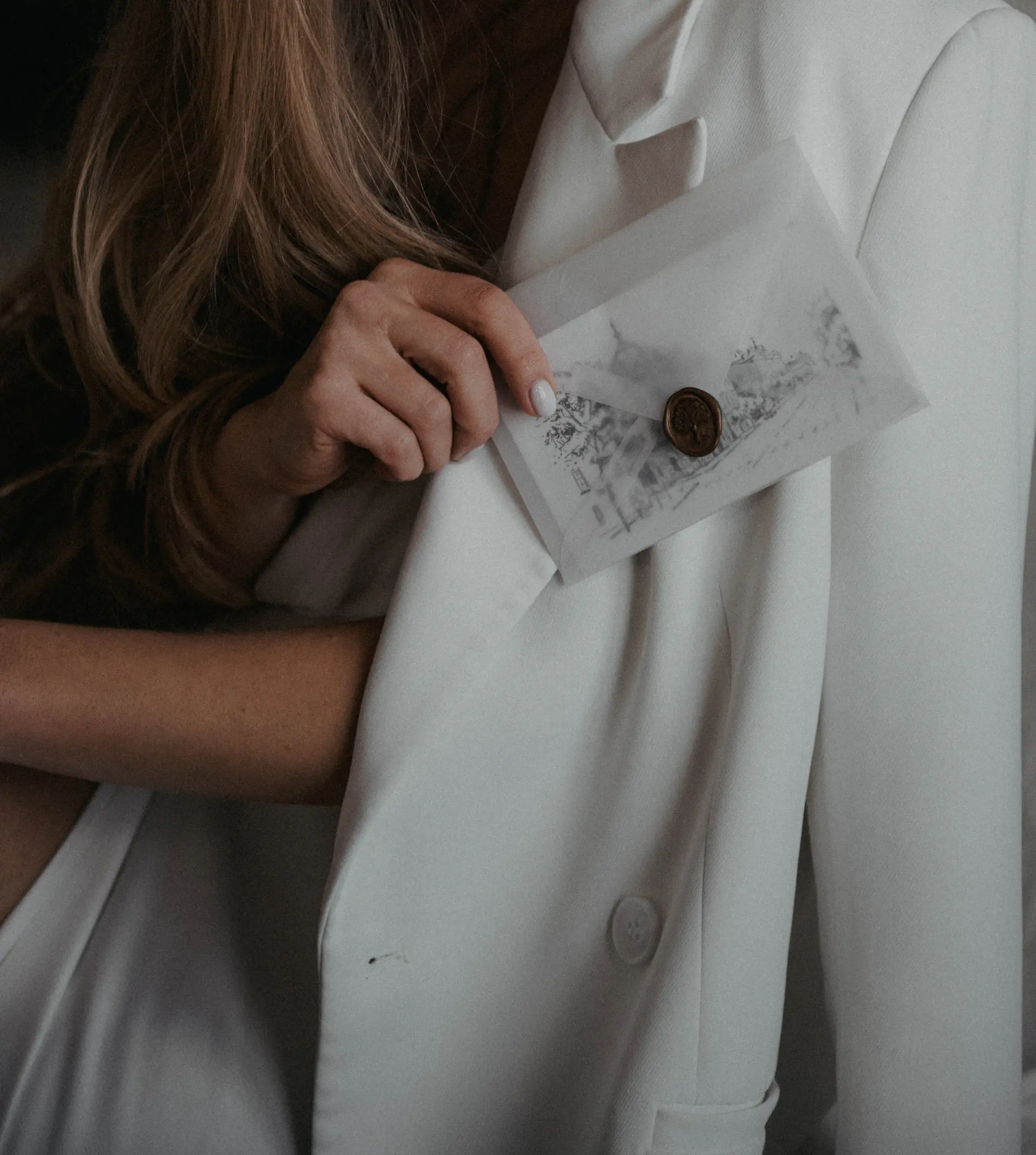 Hand-tied silk ribbon and wax seal detail