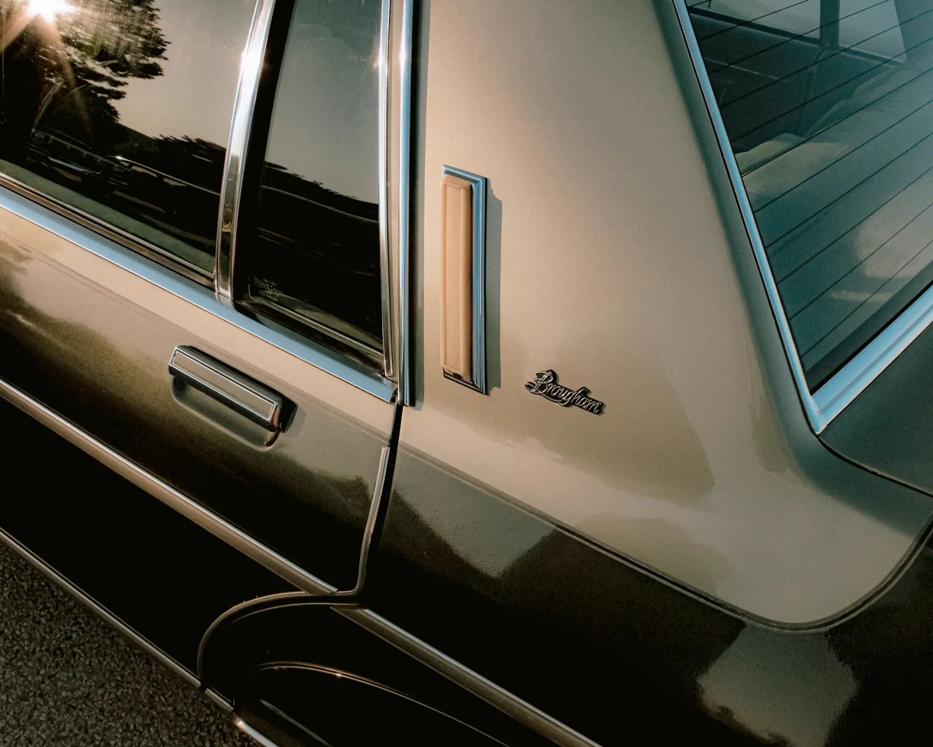 Macro detail of a hand-mixed bespoke paint finish on a body panel