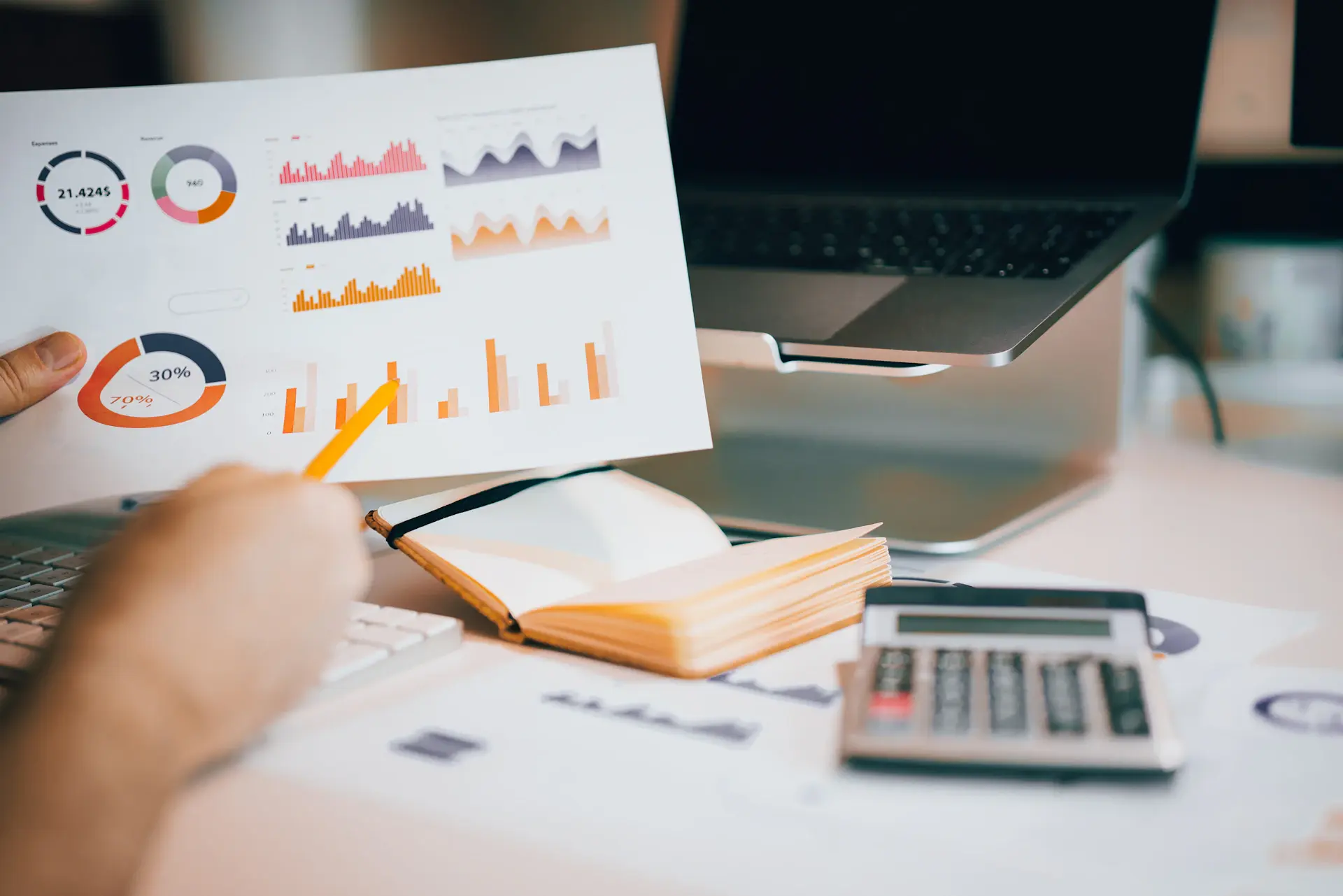 Wealth strategy charts and portfolio allocation on a clean desk