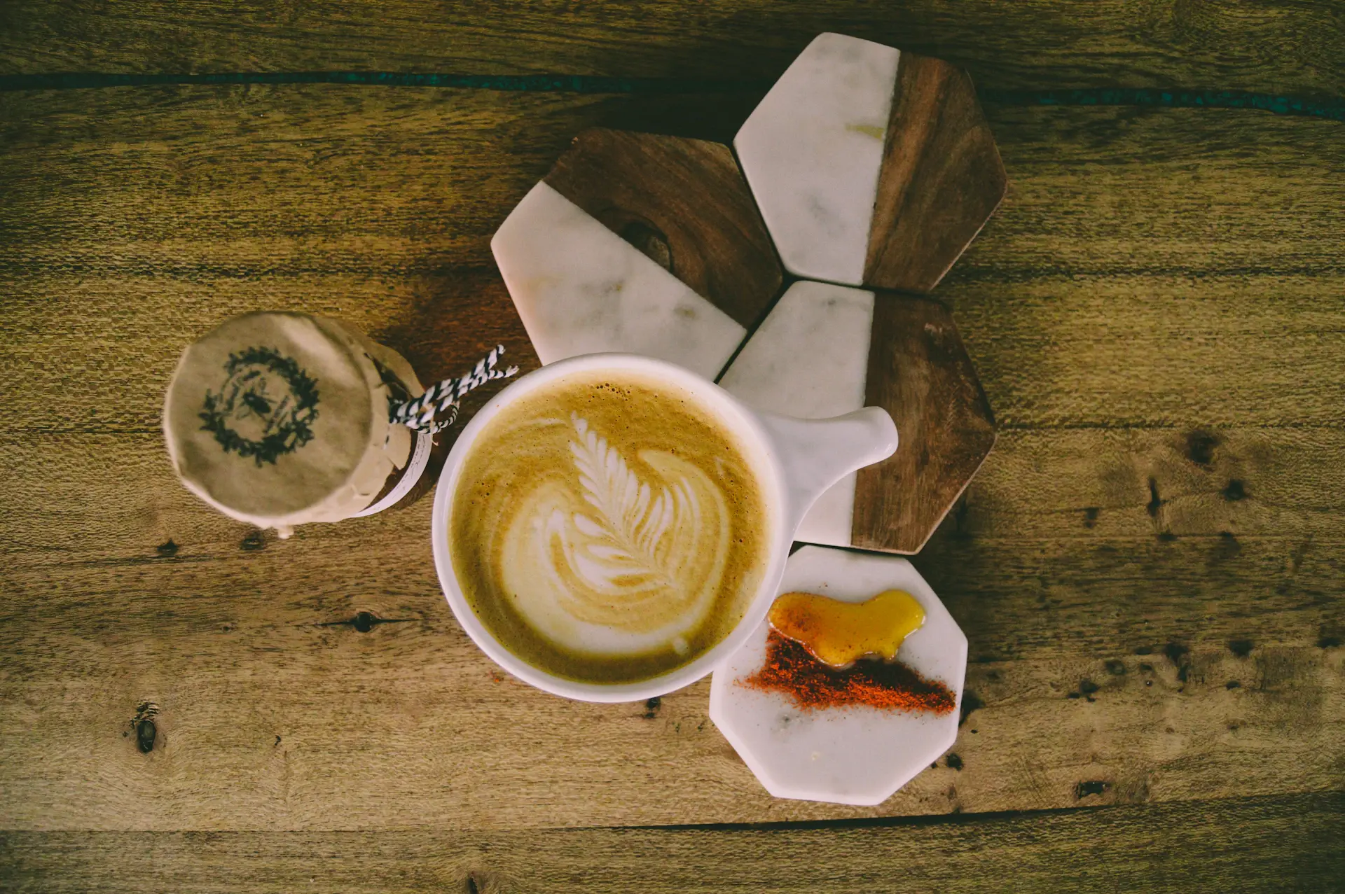 Saigon honey latte in a warm ceramic cup, golden foam