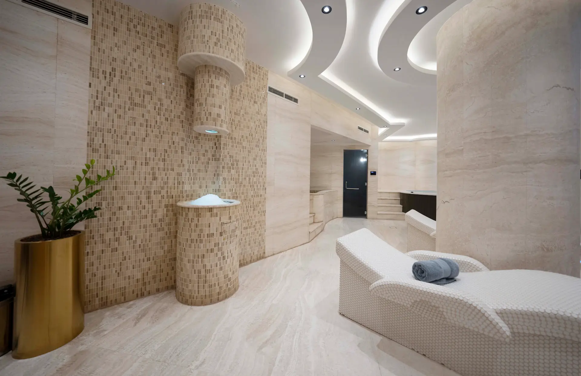 Marble and glass clinic interior bathed in warm light