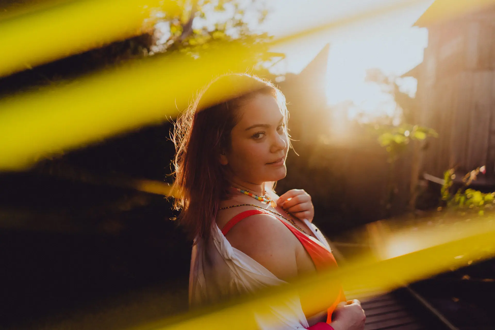 A designer at work in a sunlit studio, photographed in editorial portrait style