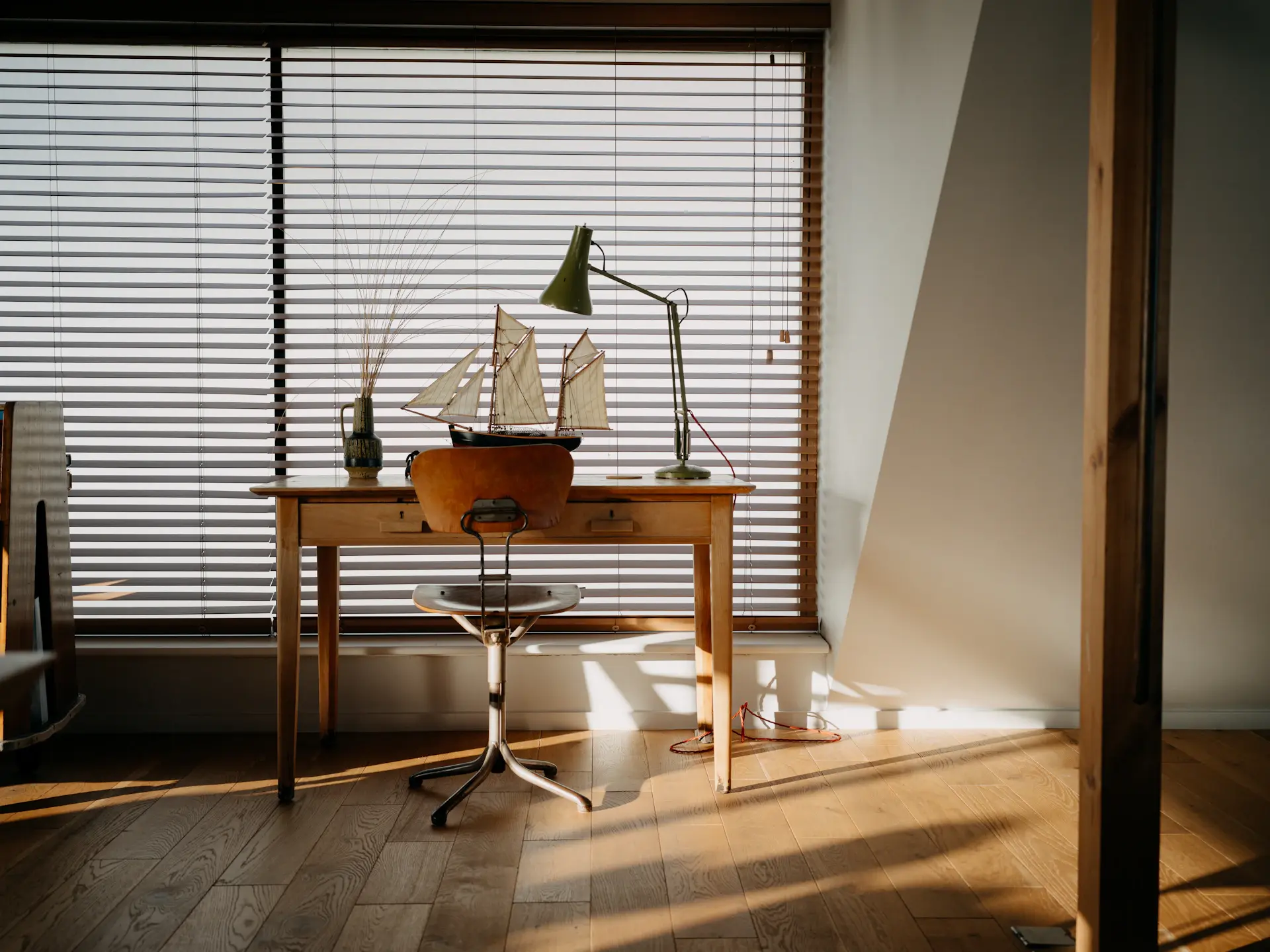 Sunlight falling through a window onto a designer's desk