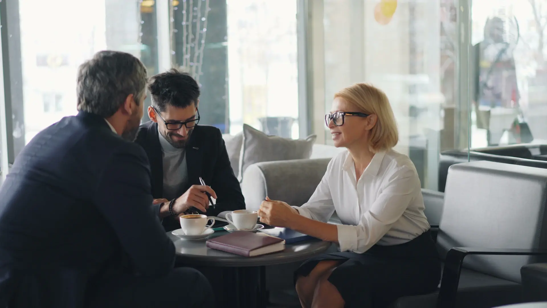 Numera advisor in conversation with a client in a bright modern interior