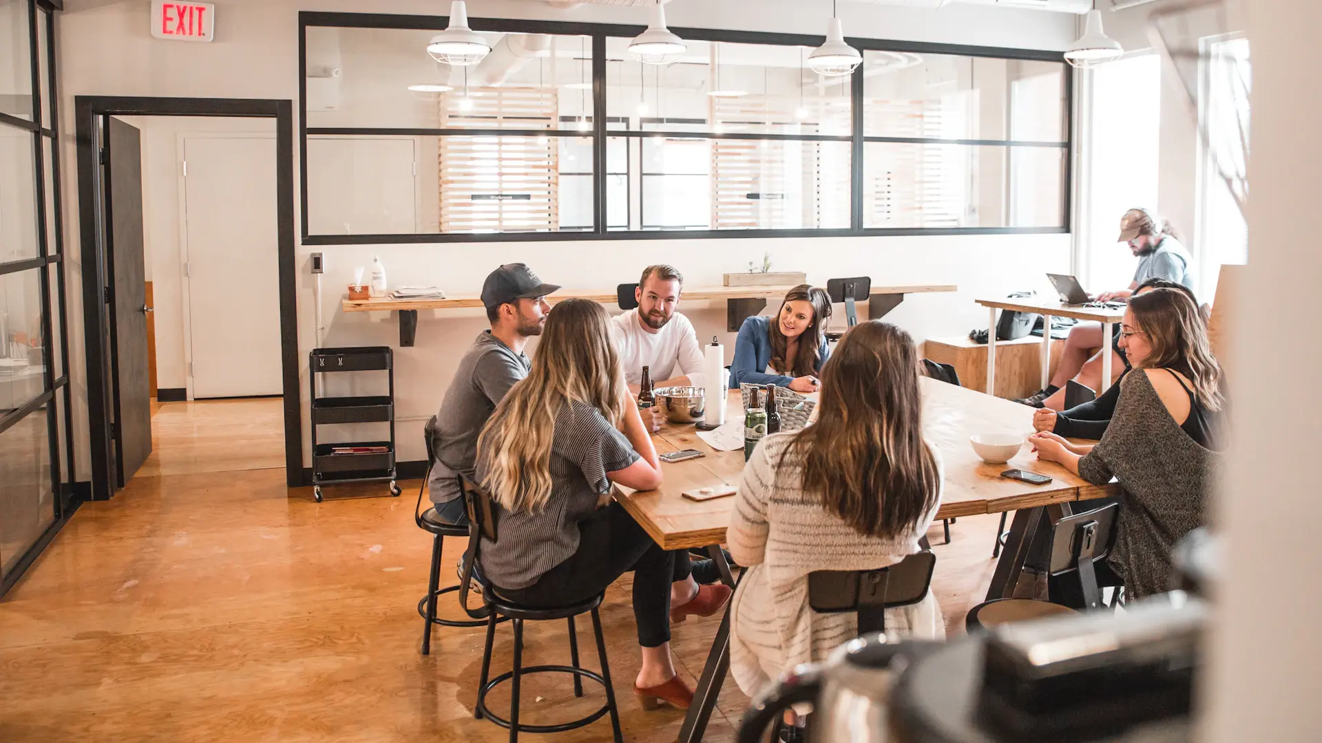 Team standup in a bright open office