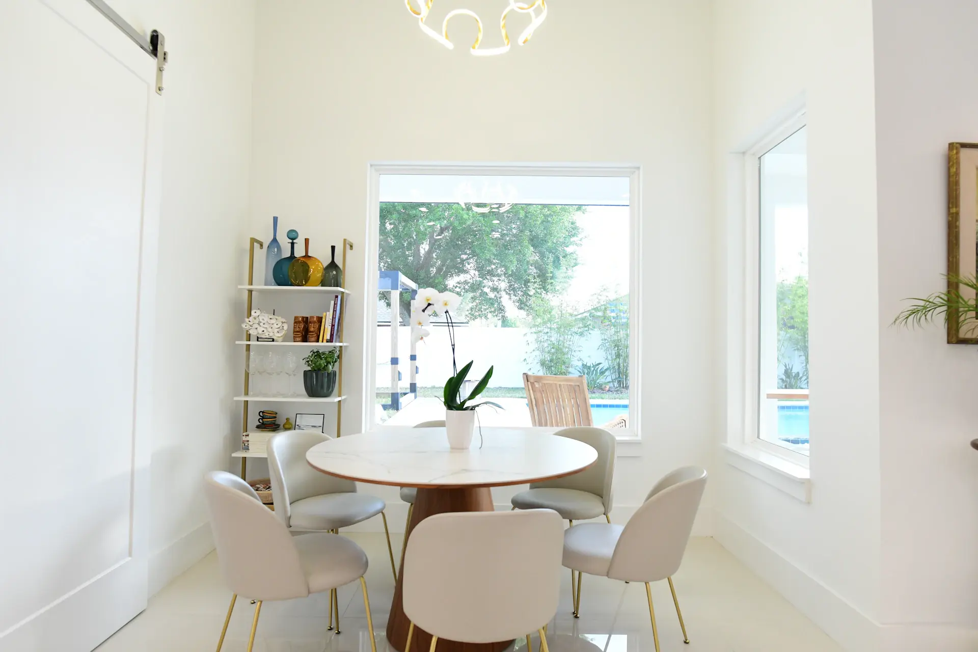 Bright editorial portrait of a young founder in a modern light-filled space