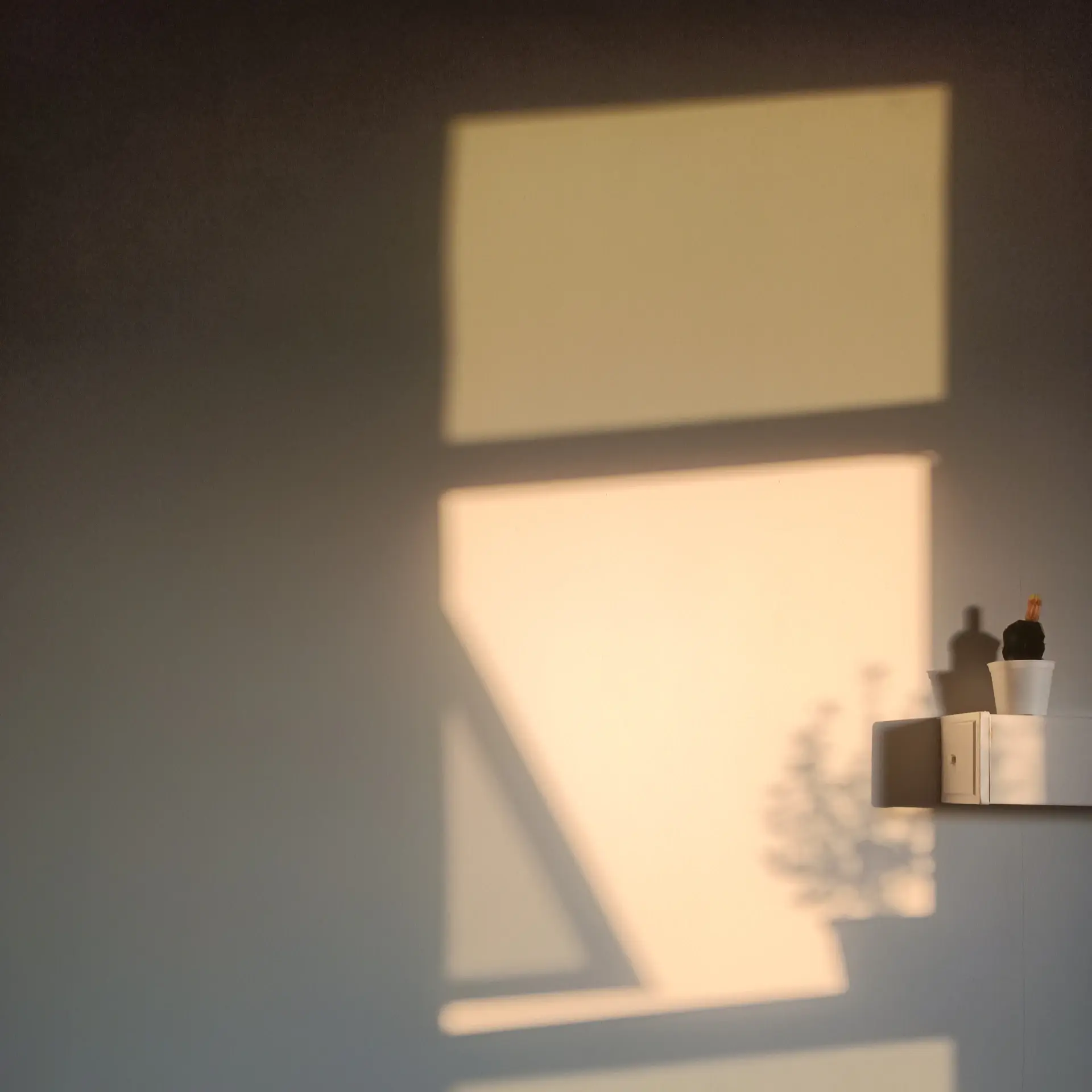 Interior with light falling across pale walls
