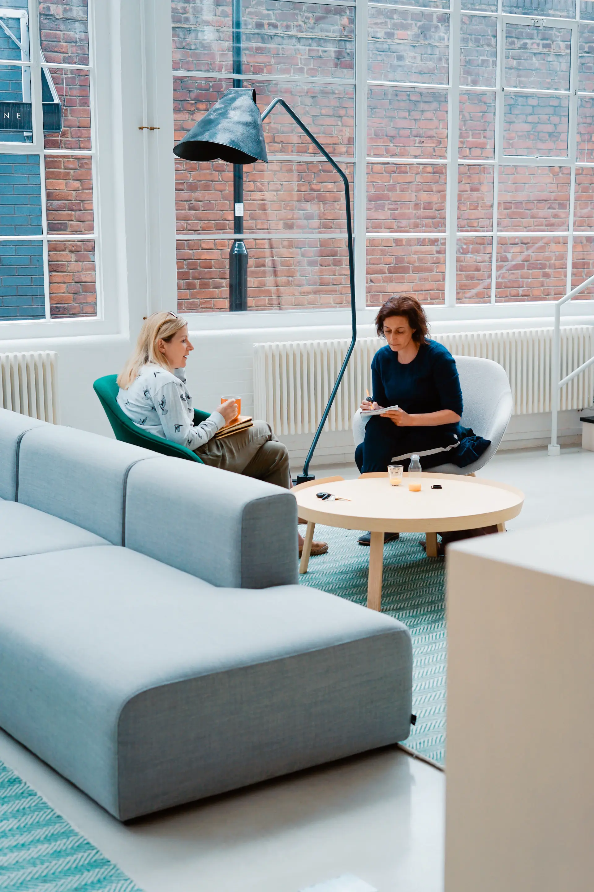 MangoAds team collaborating in a bright modern workspace