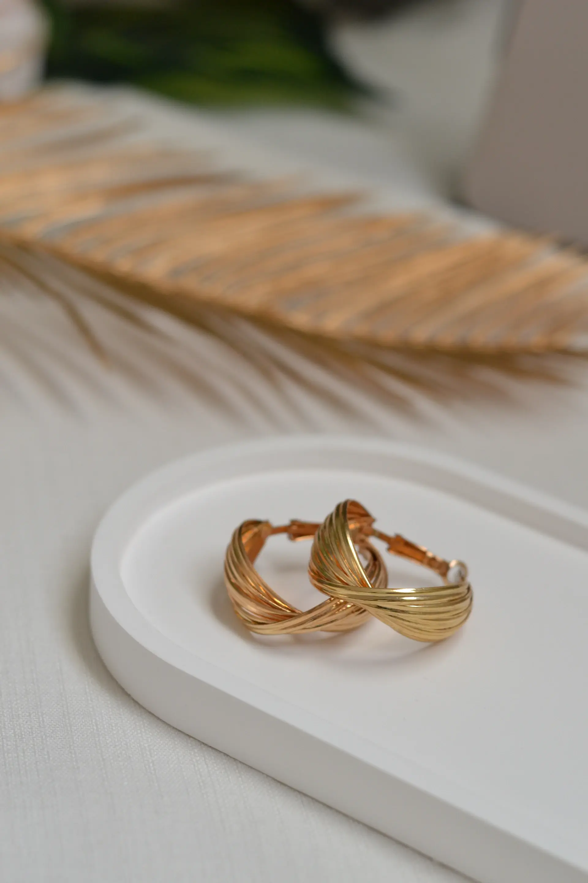 Pair of gold wedding bands on silk