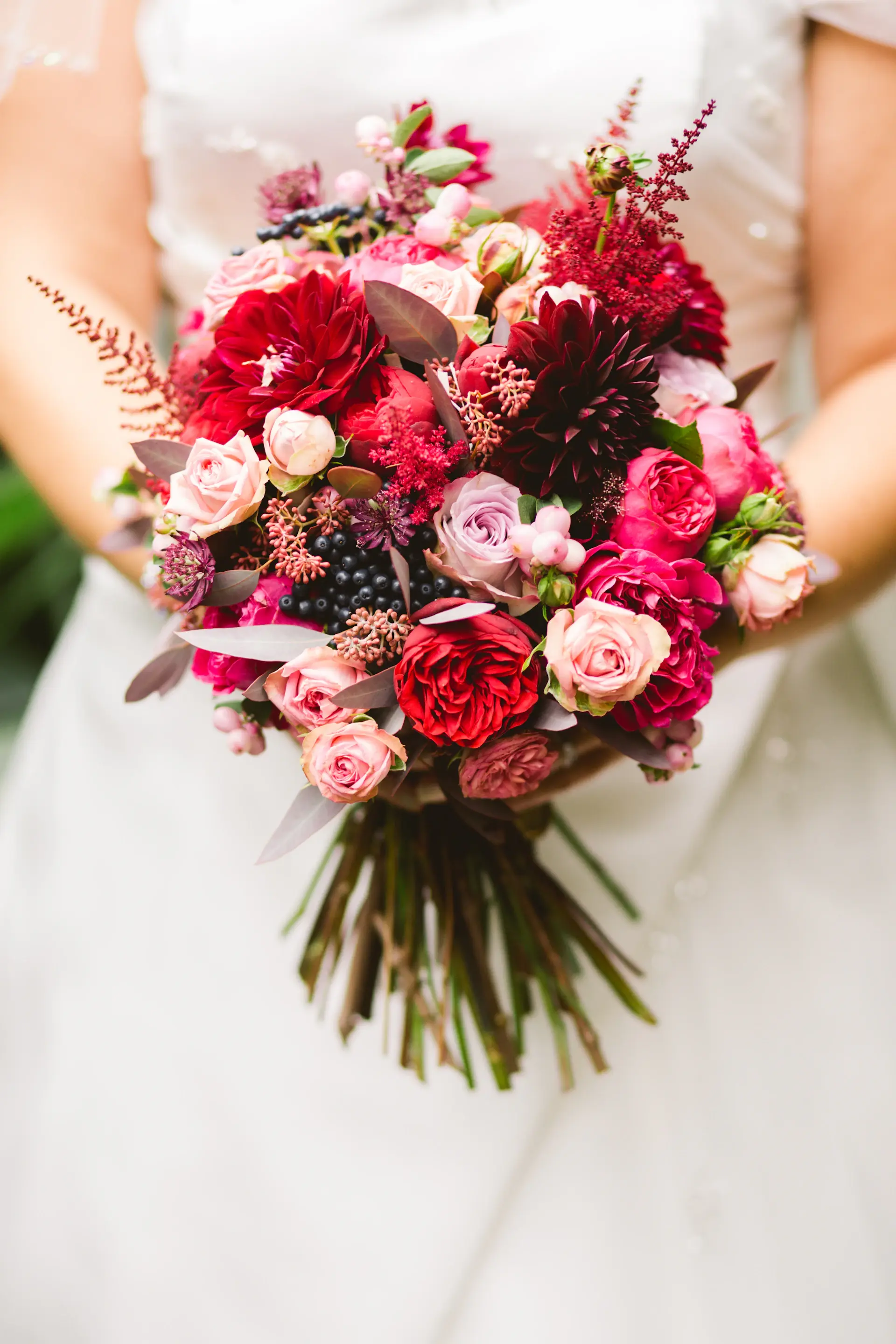 A champagne rose on an ivory editorial backdrop