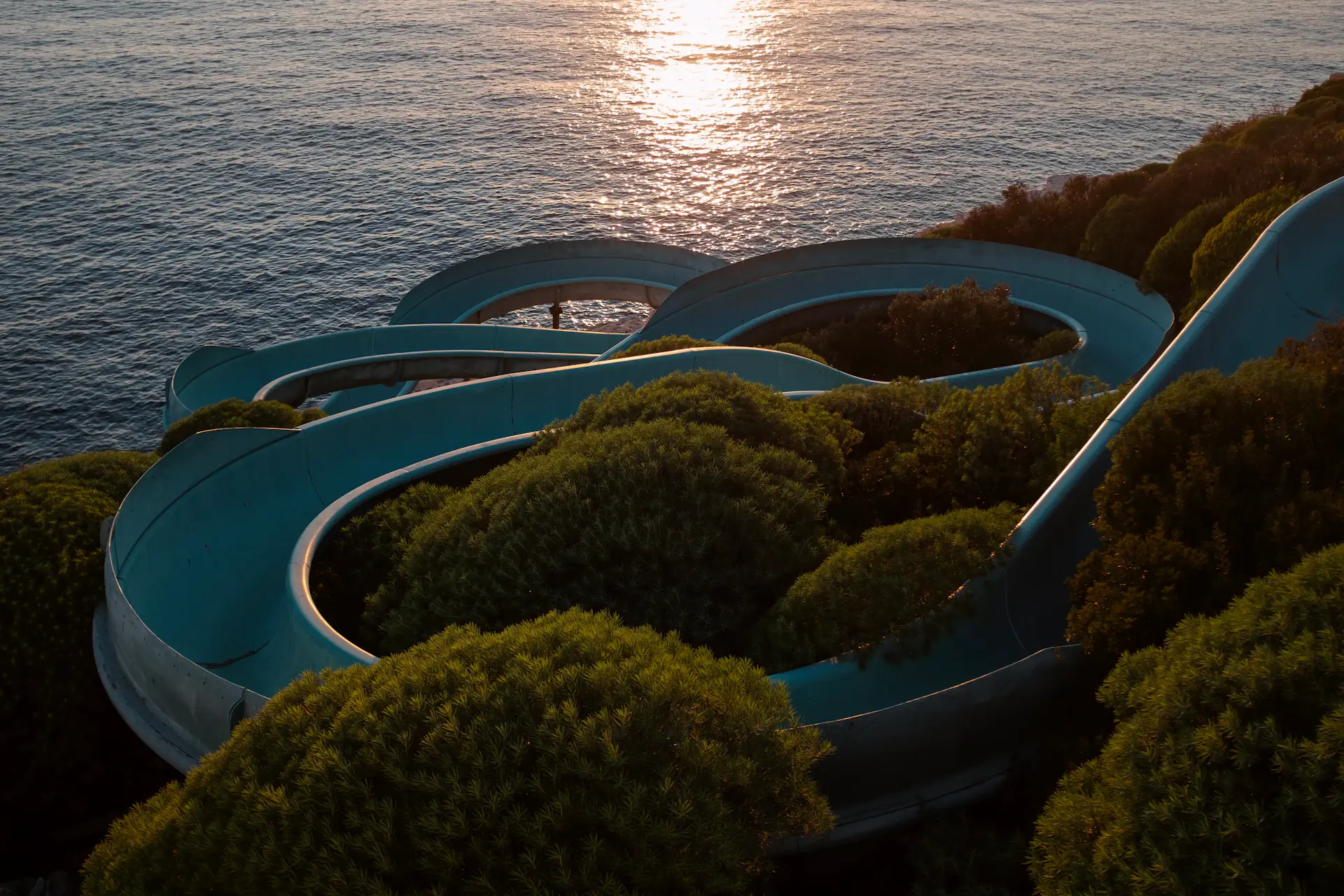 Hillside villa with infinity pool at dusk