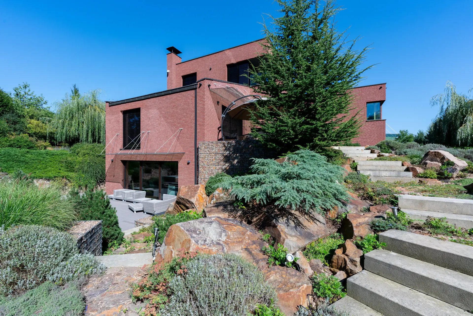 Hillside villa with terraced gardens overlooking the bay