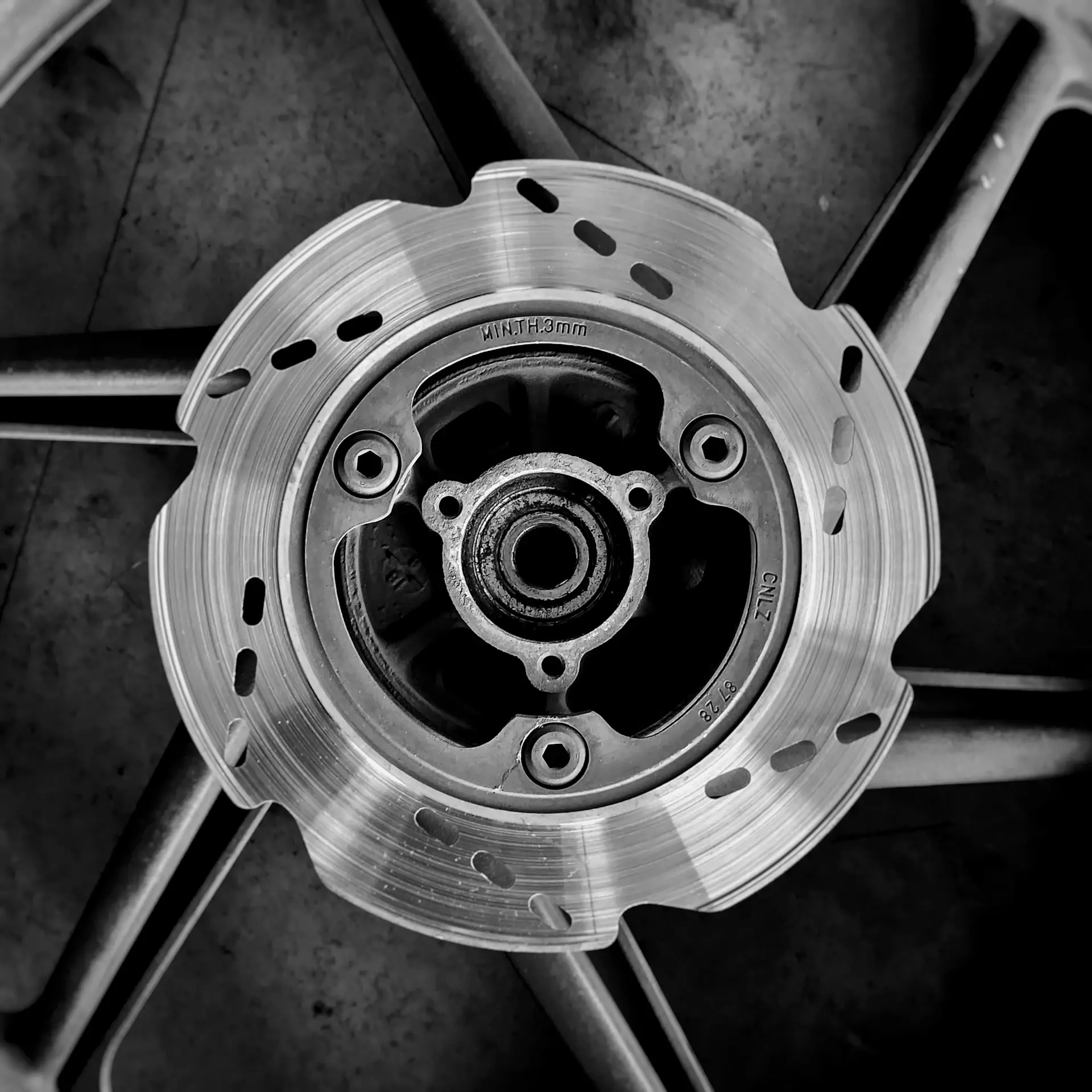 Detail of milled alloy wheel and brake caliper