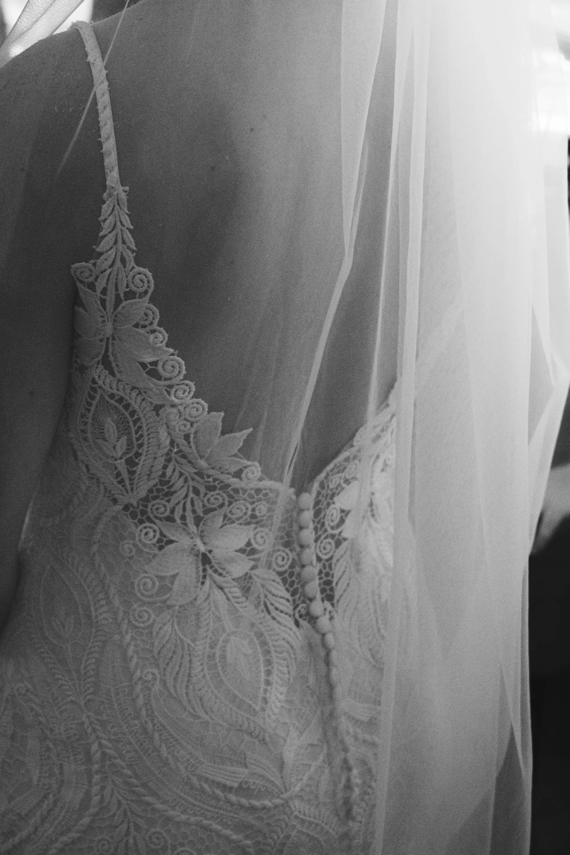 A bride's veil and dress detail