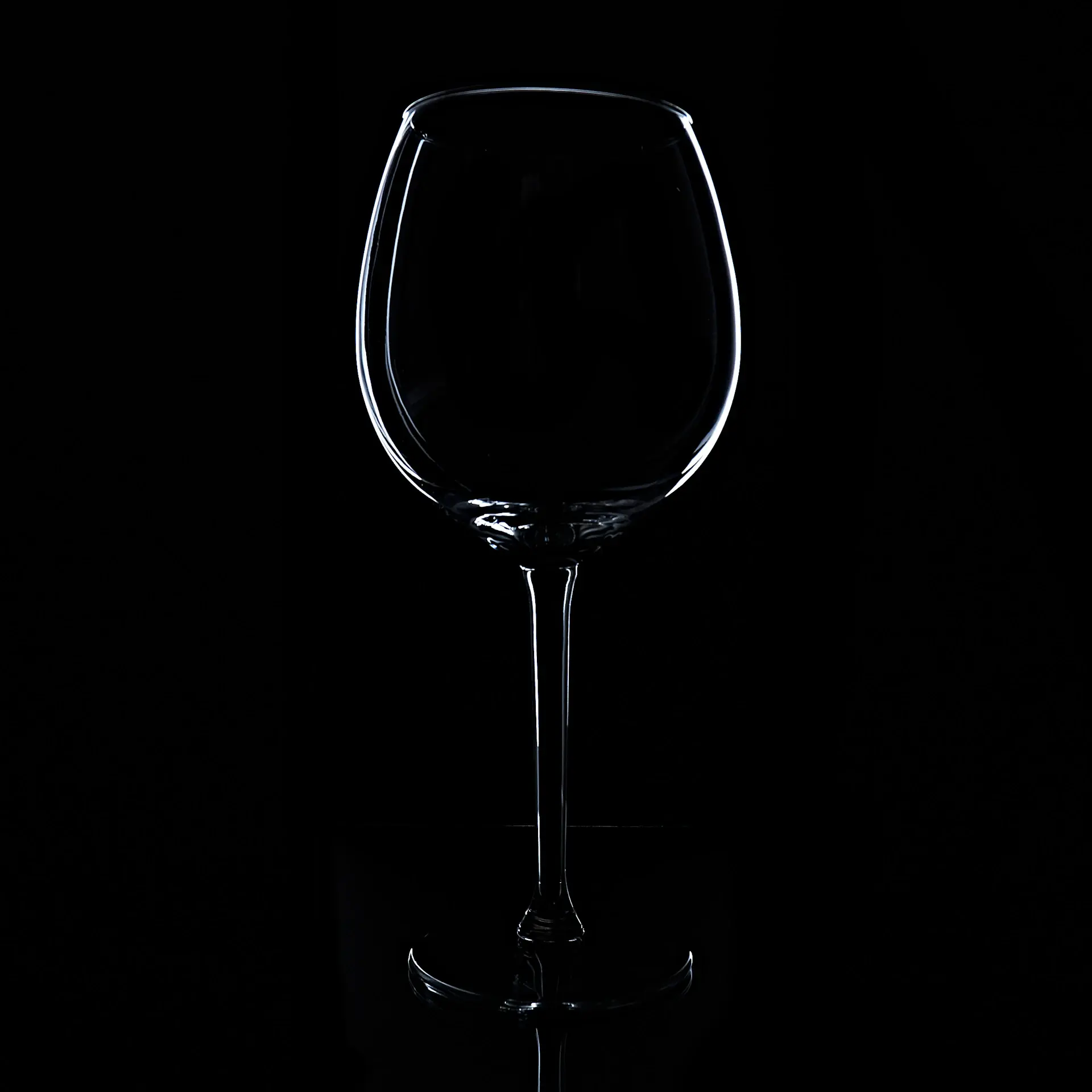 A coupe of vintage champagne beside a finely plated dish