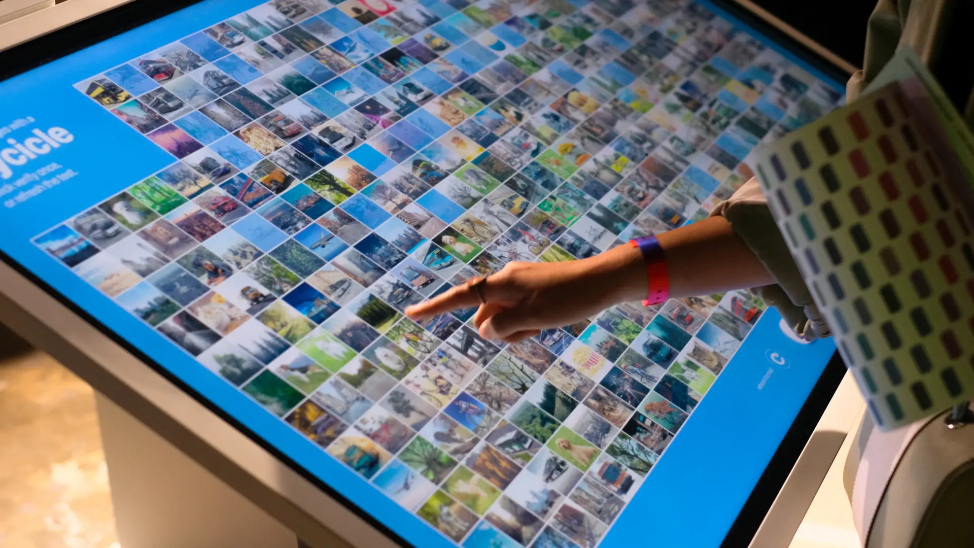 Designer reviewing a website layout on a large screen