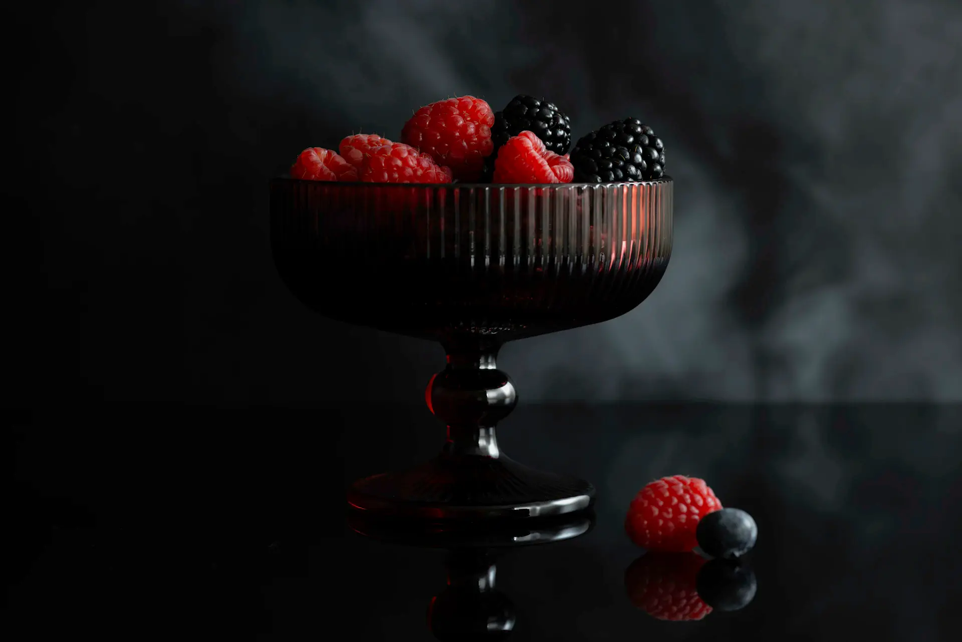 A glass of wine beside a finely plated dish