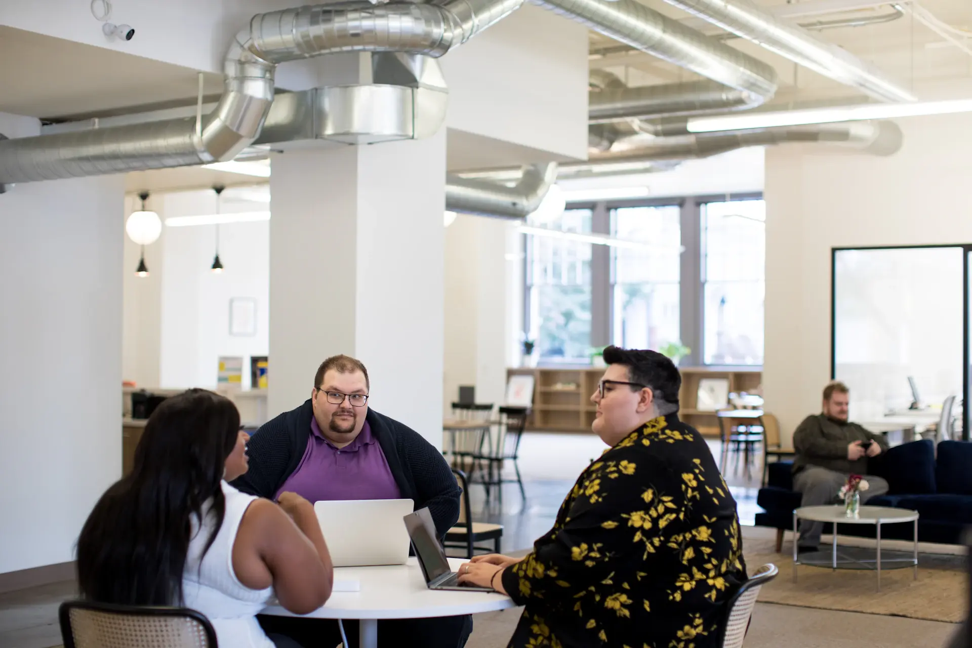 Advisor and client in a bright meeting discussing wealth goals