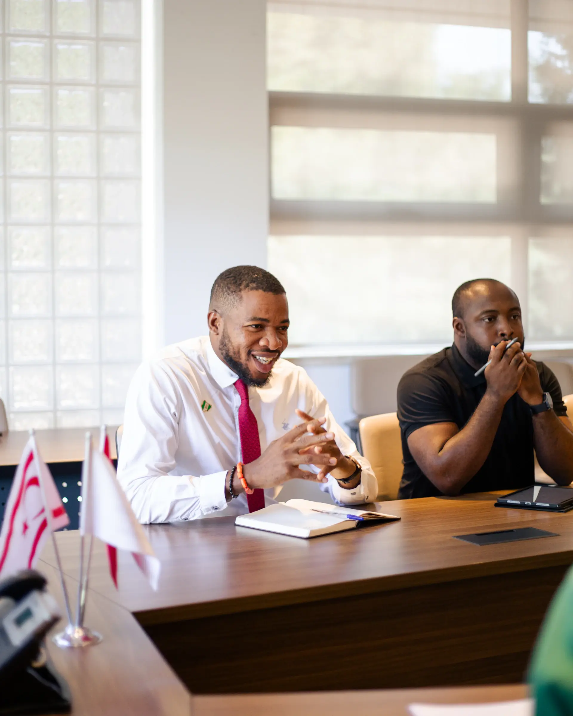 Colleagues laughing during a team meeting