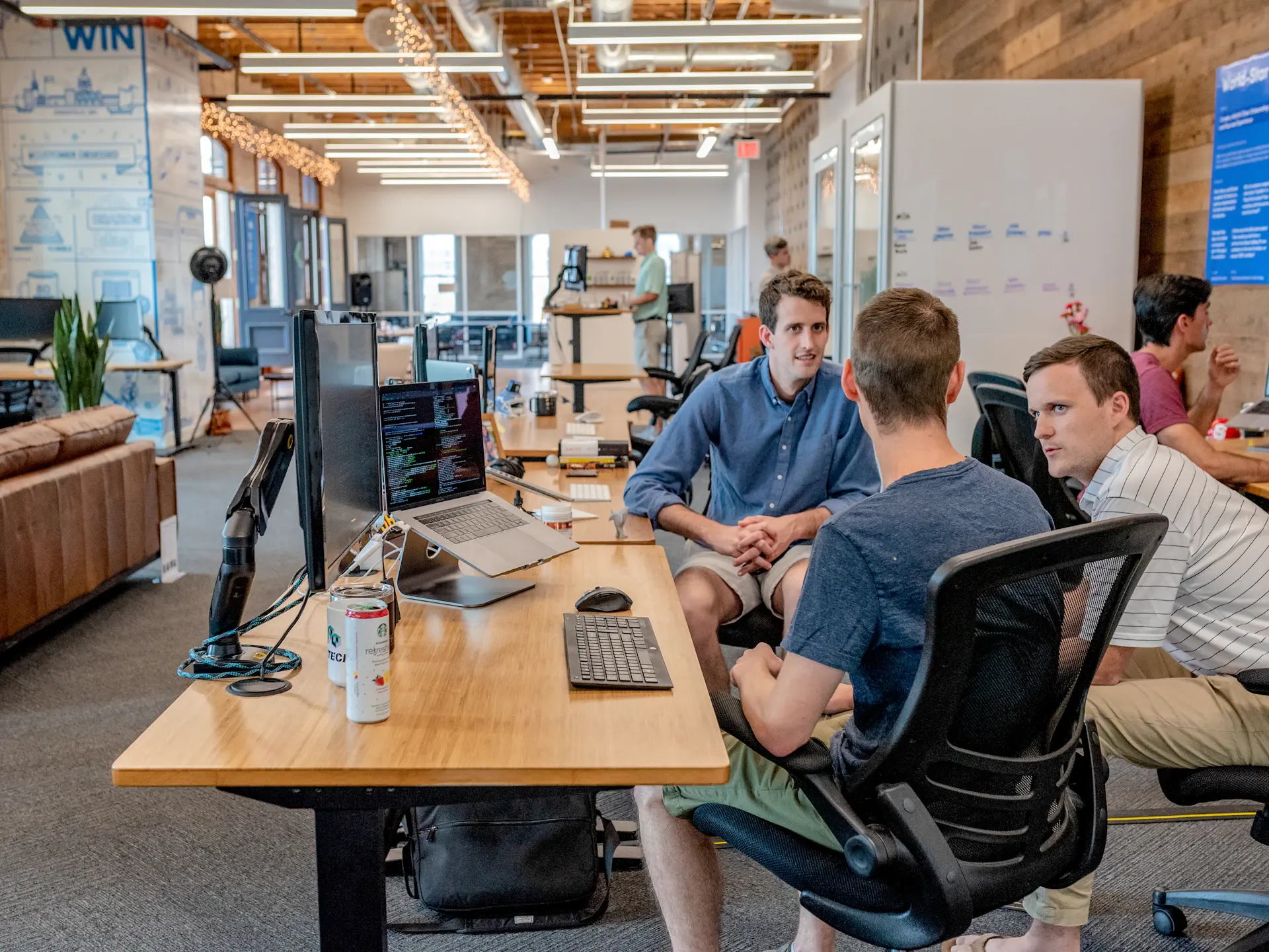 Engineers pairing on code at a bright desk