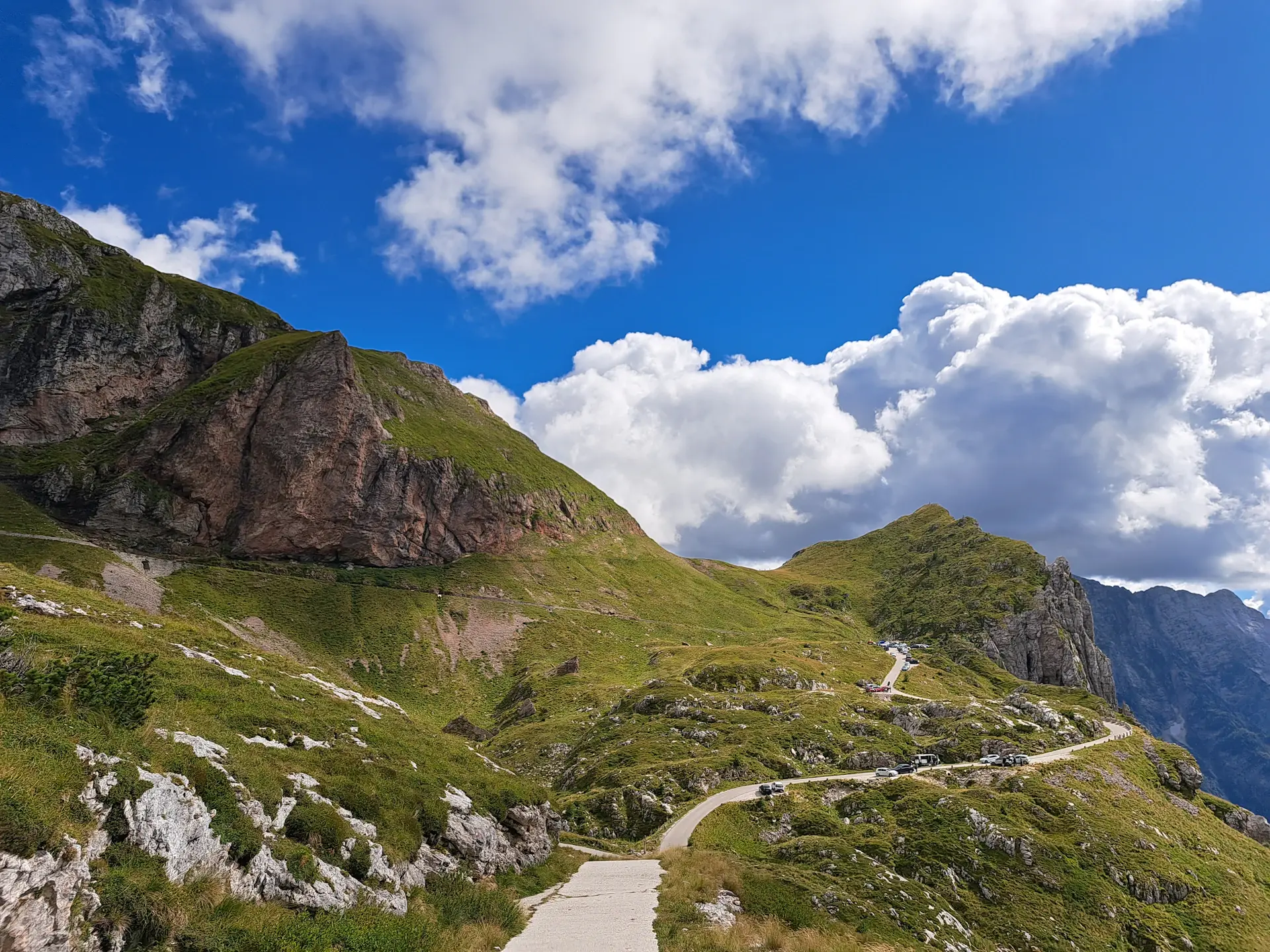 A narrow trail winding through a high mountain pass