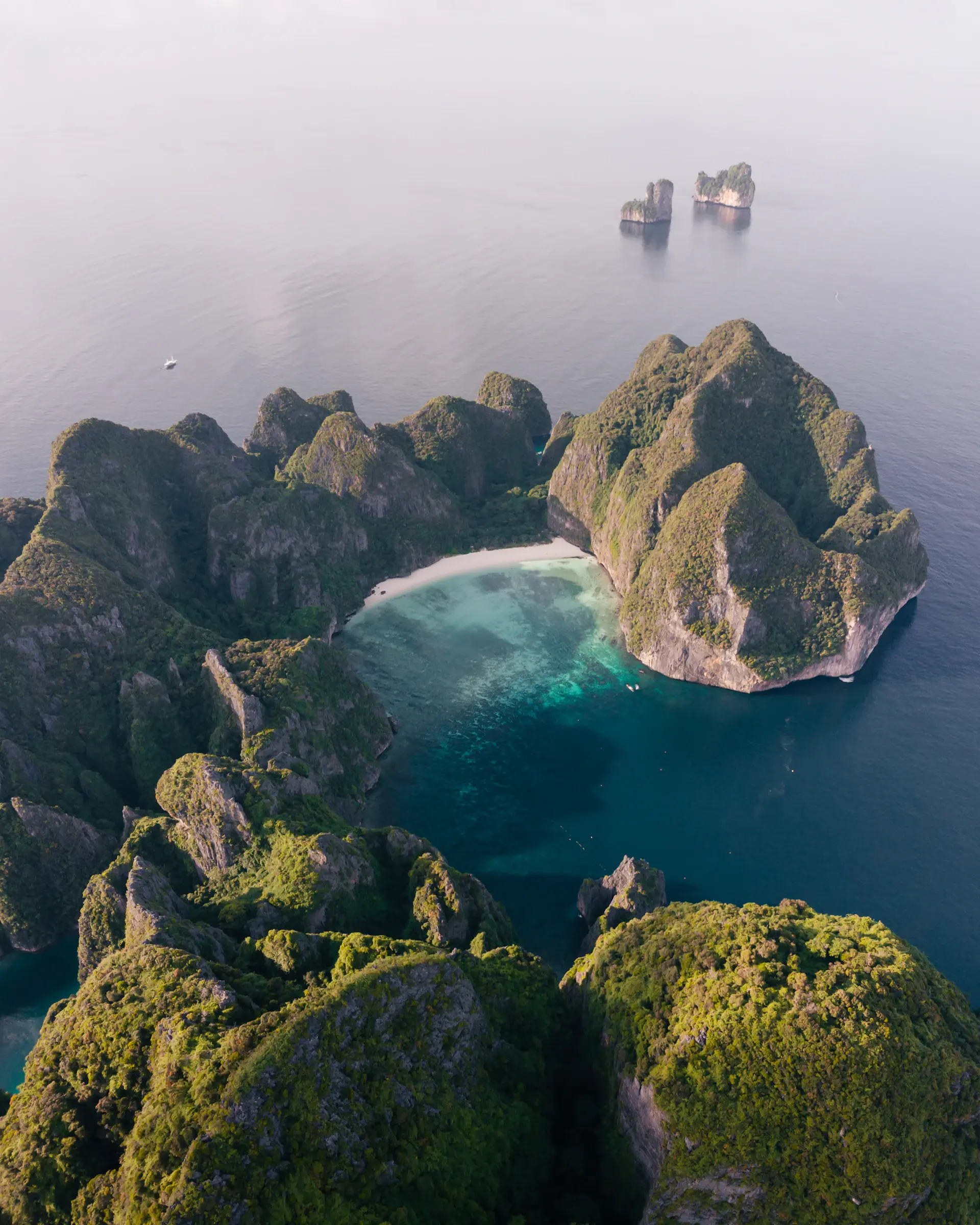 Limestone islets scattered across a luminous turquoise sea