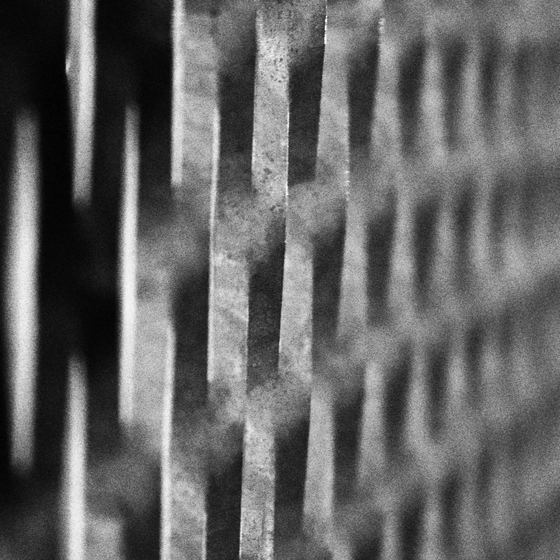 Macro of smoked carbon-fibre weave